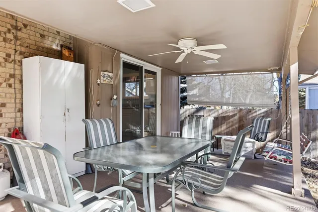 a view of a dining room with furniture wooden floor and chandelier