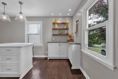 a view of kitchen with furniture and window