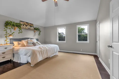 a bedroom with bed and window