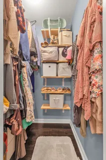 a bedroom with furniture and a window