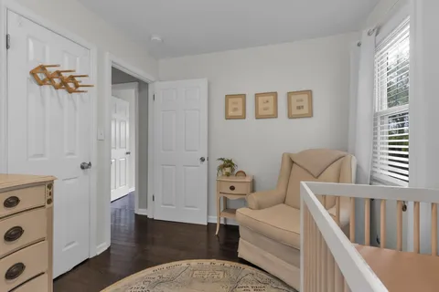 a bedroom with two beds and a window