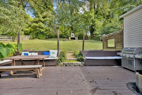 a view of a chairs and table on the deck