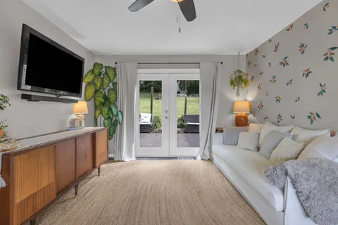 a living room with furniture and a flat screen tv