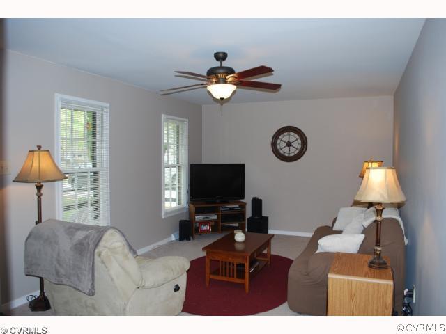 11121 Alanthus Road Midlothian, VA 23112 - Photo 2 of 12 a living room with furniture a window and a flat screen tv