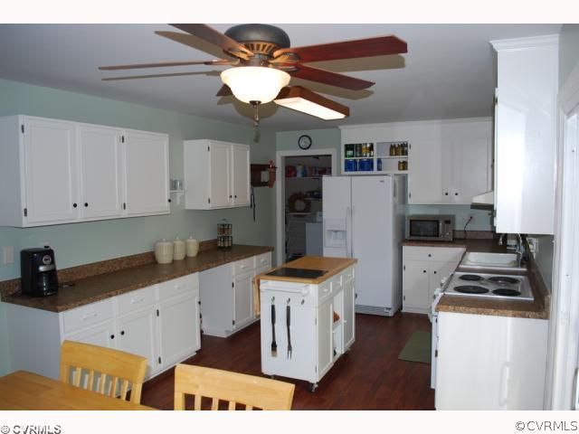 11121 Alanthus Road Midlothian, VA 23112 - Photo 4 of 12 a kitchen with stainless steel appliances granite countertop a sink a stove a refrigerator and cabinets