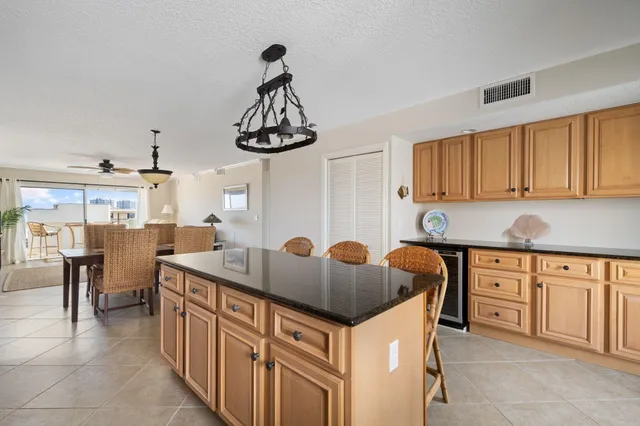 a kitchen with stainless steel appliances a sink and cabinets