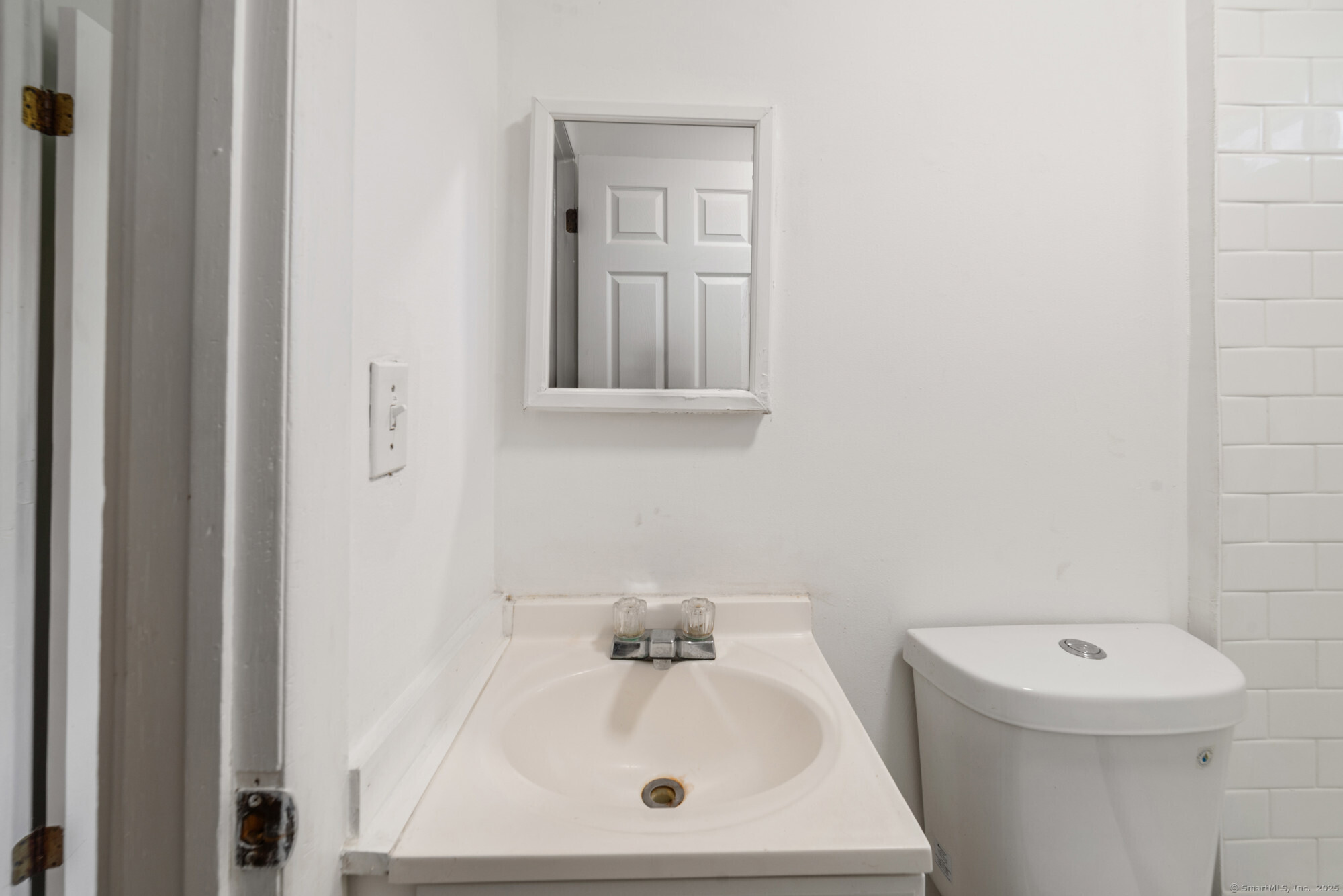 23 Salem Street Naugatuck, CT 06770 - Photo 17 of 40 a bathroom with a sink a toilet and mirror
