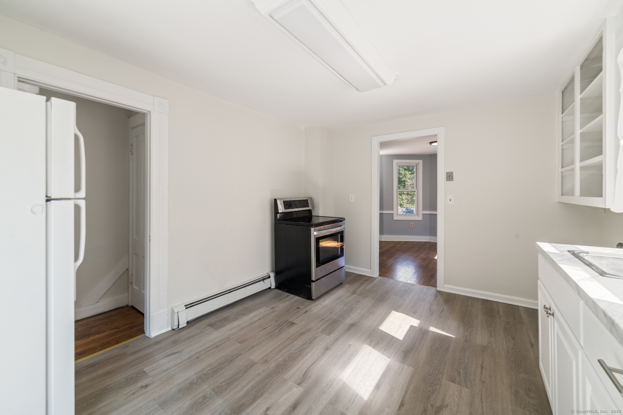 23 Salem Street Naugatuck, CT 06770 - Photo 20 of 40 a view of a kitchen with a refrigerator a stove top oven and cabinets