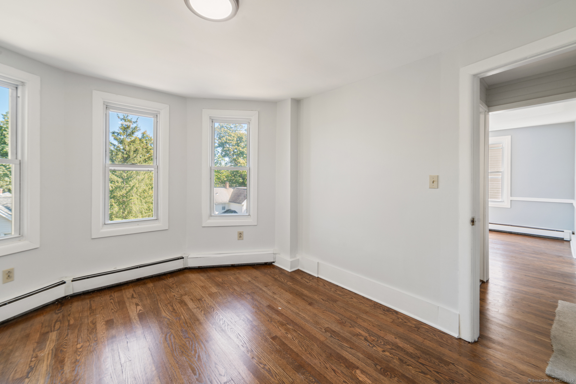 23 Salem Street Naugatuck, CT 06770 - Photo 21 of 40 an empty room with wooden floor and windows