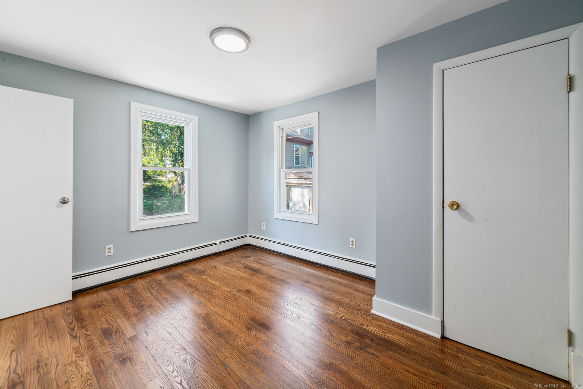 23 Salem Street Naugatuck, CT 06770 - Photo 23 of 40 an empty room with wooden floor and windows