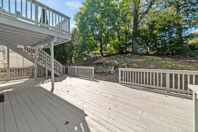 a view of deck with wooden floor and fence
