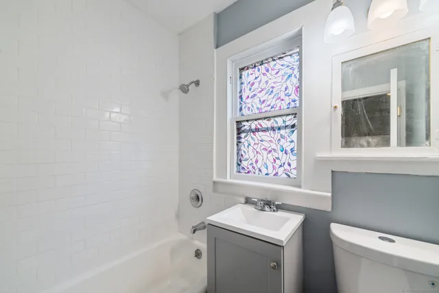 a bathroom with a sink a toilet and a bathtub