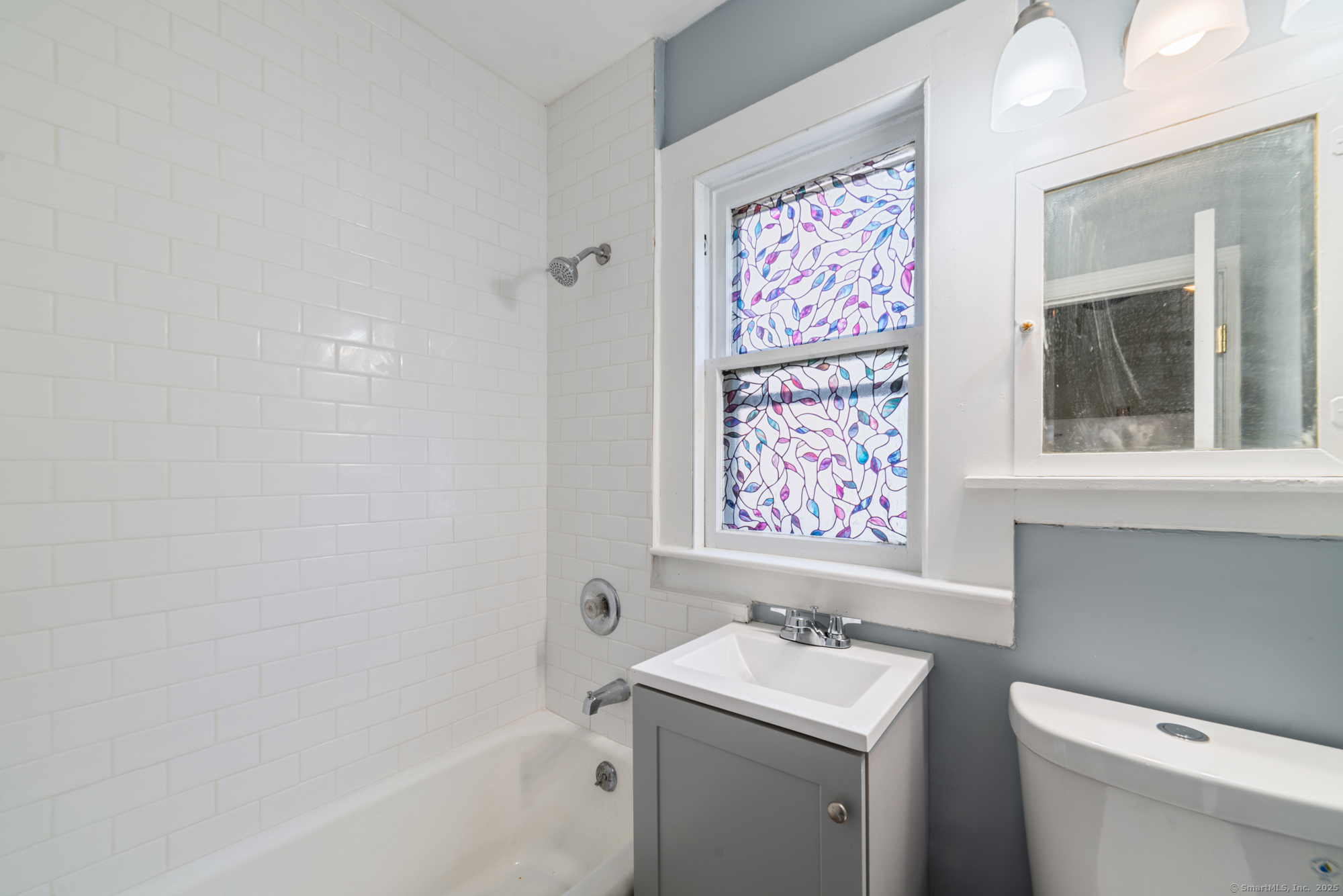 23 Salem Street Naugatuck, CT 06770 - Photo 8 of 40 a bathroom with a sink a toilet and a bathtub