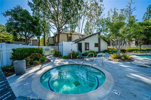 a front view of a house with outdoor seating