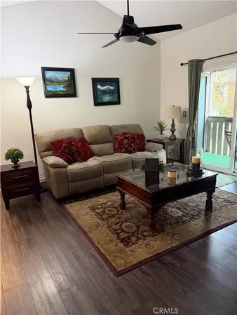 a living room with furniture and a rug