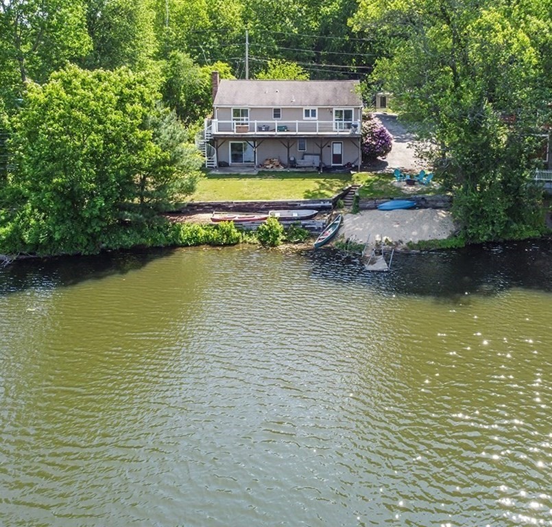 a aerial view of a house with a large pool