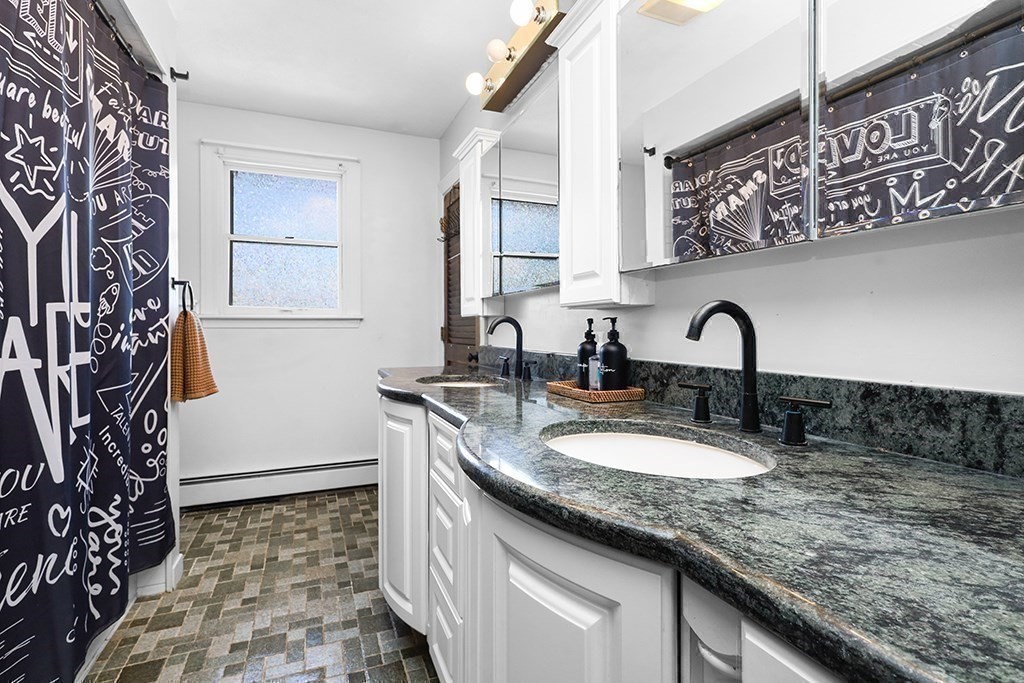 163 Walnut Road Wrentham, MA 02093 - Photo 14 of 39 a bathroom with a granite countertop sink a mirror and shower