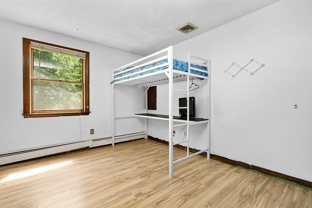 163 Walnut Road Wrentham, MA 02093 - Photo 15 of 39 a view of a livingroom with wooden floor and a window