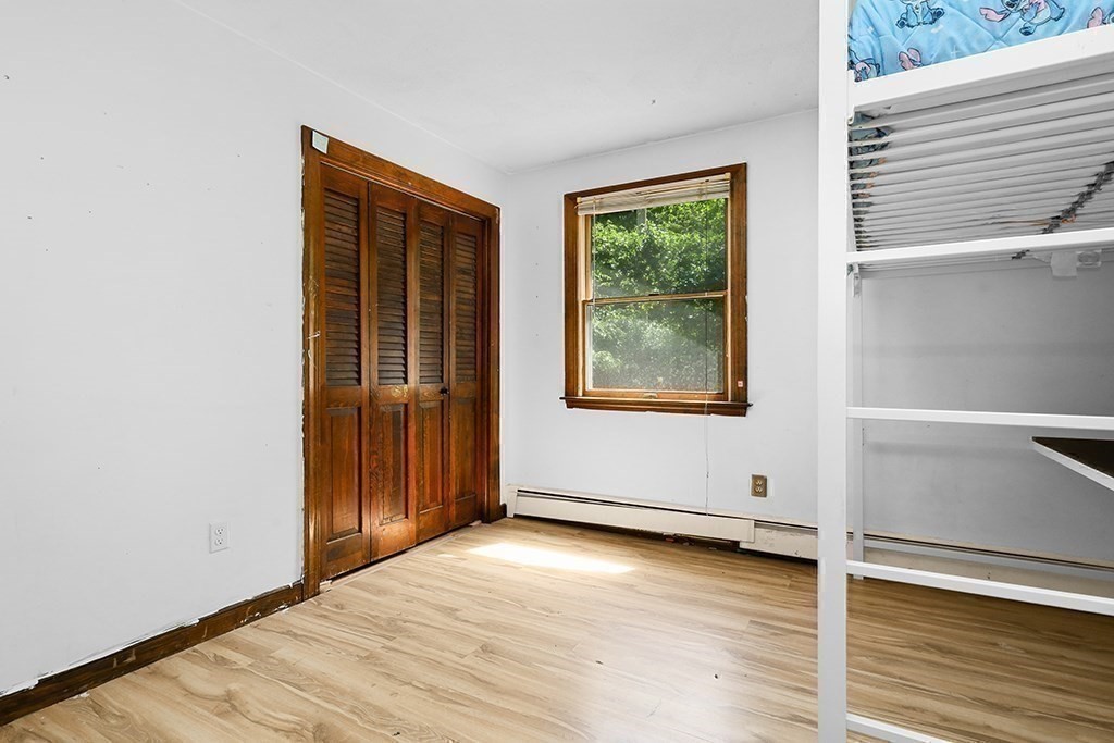 163 Walnut Road Wrentham, MA 02093 - Photo 16 of 39 an empty room with wooden floor and windows