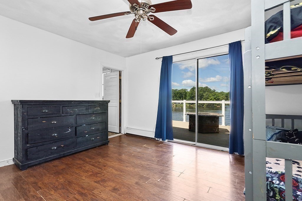 163 Walnut Road Wrentham, MA 02093 - Photo 20 of 39 a view of a livingroom with a ceiling fan and window
