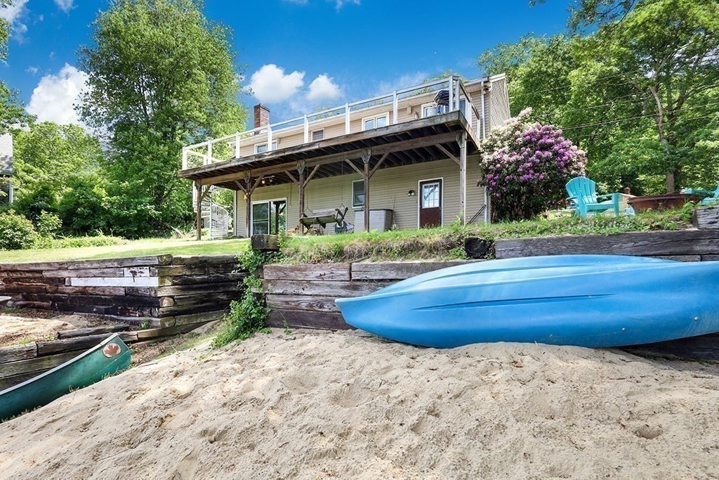 163 Walnut Road Wrentham, MA 02093 - Photo 23 of 39 a front view of a house with a yard and potted plants