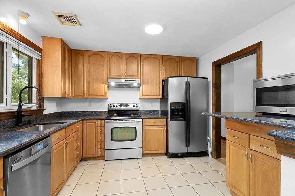 163 Walnut Road Wrentham, MA 02093 - Photo 3 of 39 a kitchen with a refrigerator sink and microwave