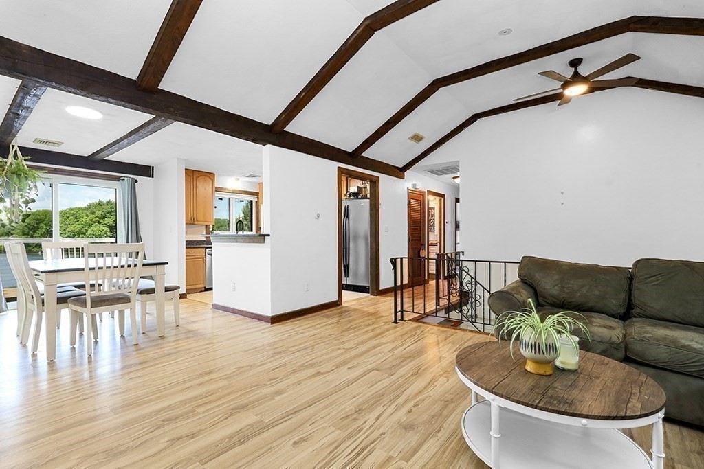 163 Walnut Road Wrentham, MA 02093 - Photo 8 of 39 a living room with furniture and a table