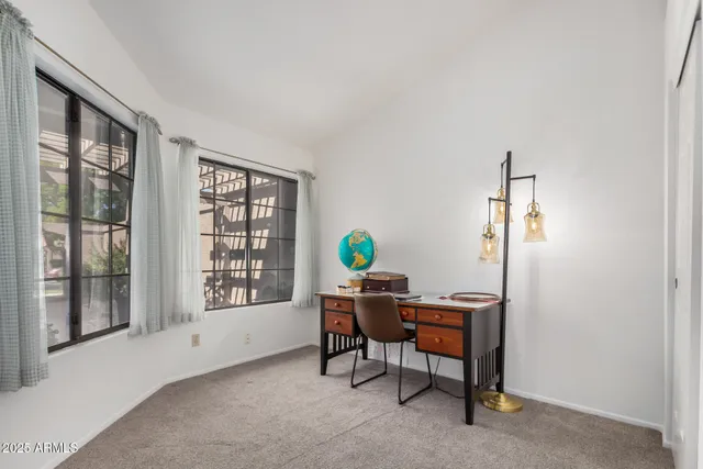 a workspace with furniture and window