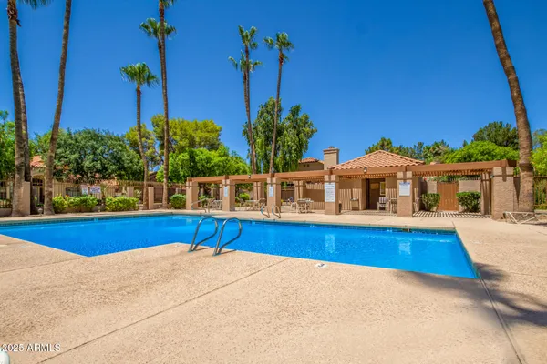 a front view of a house with swimming pool