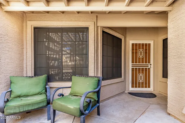 a view of a livingroom with furniture and a porch