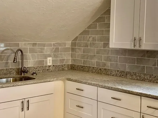 a bathroom with a sink and vanity
