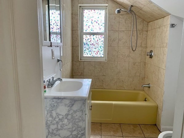 8 Boylston Street, Unit 2R Worcester, MA 01605 - Photo 4 of 4 a bathroom with a sink bathtub and a shower