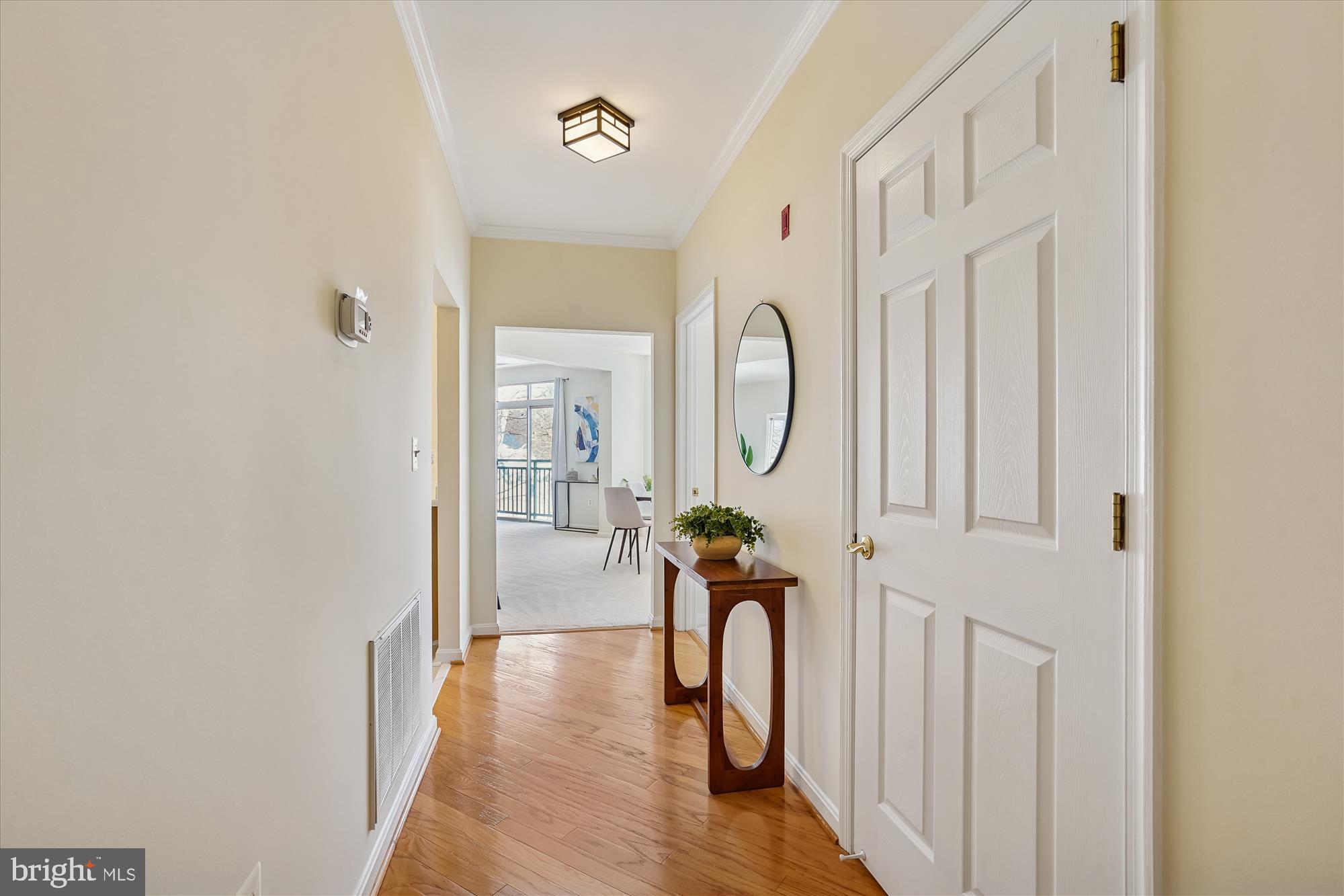 1851 Stratford Park Place, Unit 304 Reston, VA 20190 - Photo 4 of 38 Harwood flooring in entry foyer.