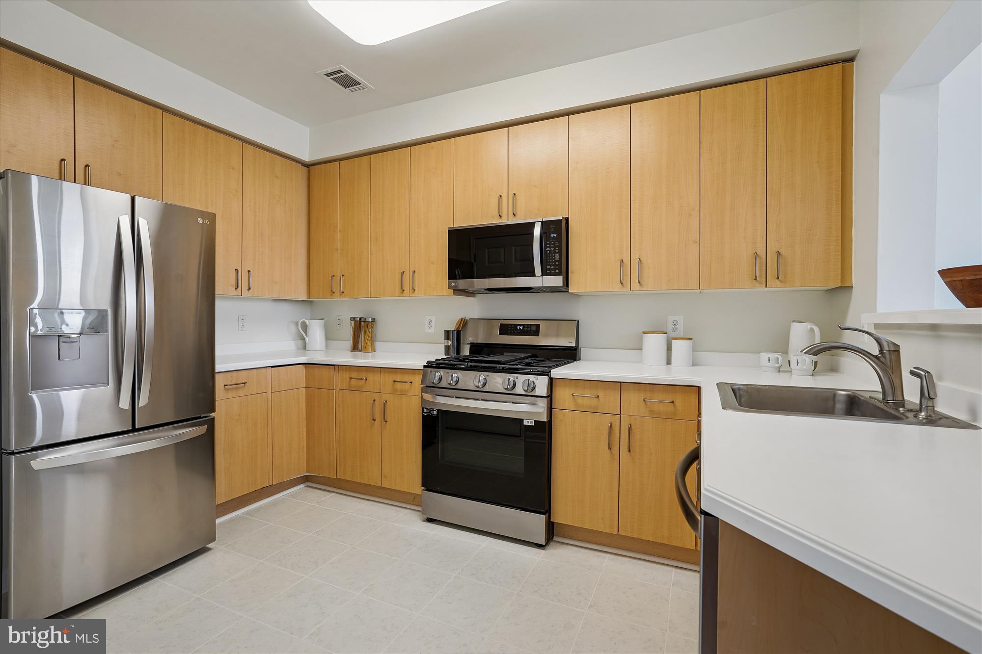 1851 Stratford Park Place, Unit 304 Reston, VA 20190 - Photo 9 of 38 New ceramic tile floor in kitchen.
