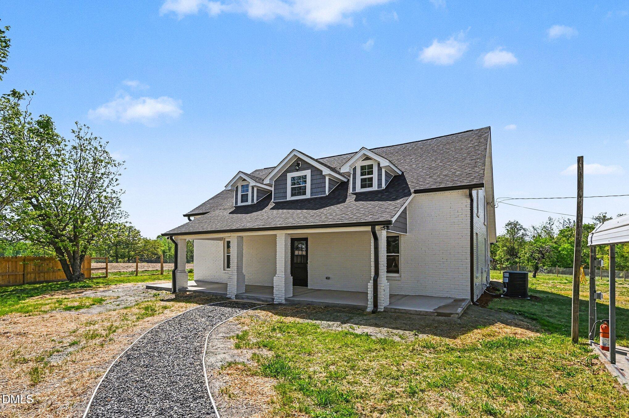 1325 Charlie Carr Road Roxboro, NC 27574 - Photo 4 of 31 a front view of a house with garden