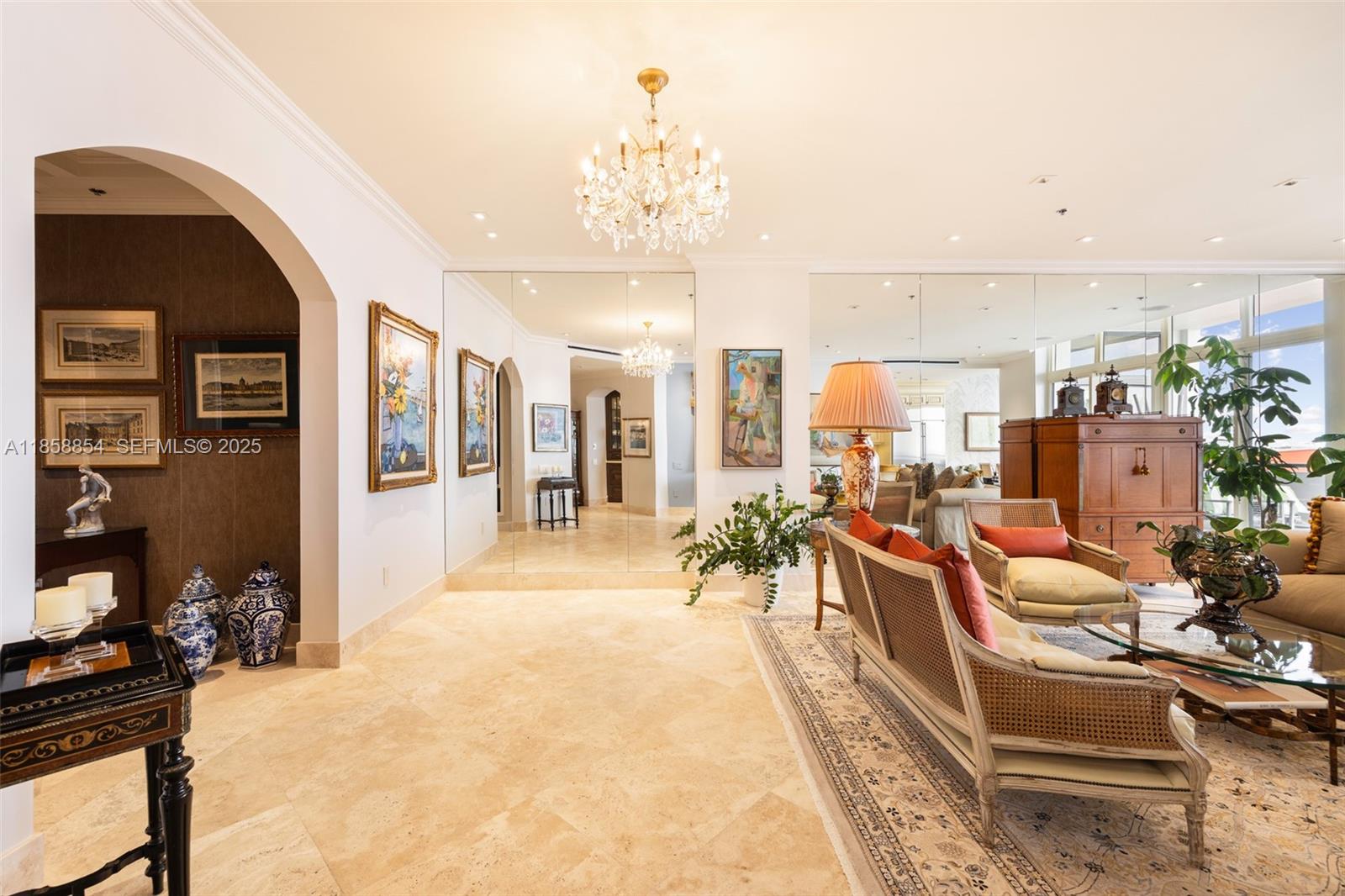 1581 Brickell Avenue, Unit T104 Miami, FL 33129 - Photo 7 of 42 a view of a livingroom with furniture and a chandelier