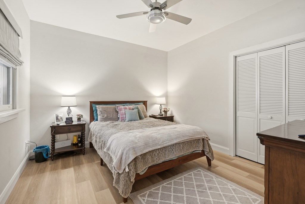 175 Crane Creek Road Young Harris, GA 30582 - Photo 25 of 40 a bedroom with a bed and a chandelier