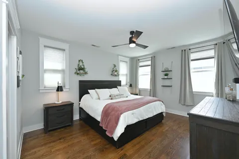 a view of an empty room and wooden floor