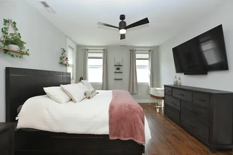 a bedroom with a bed and a window