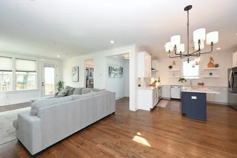 a living room with a fireplace and a flat screen tv