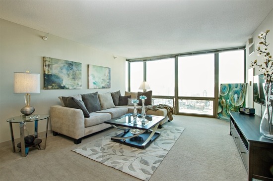 2 East Erie Street, Unit 3906 Chicago, IL 60611 - Photo 4 of 13 a living room with furniture and a large window