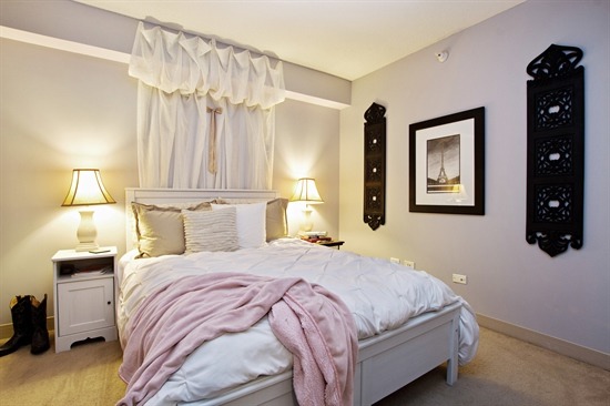 2 East Erie Street, Unit 3906 Chicago, IL 60611 - Photo 10 of 13 a bedroom with a bed and a night stand