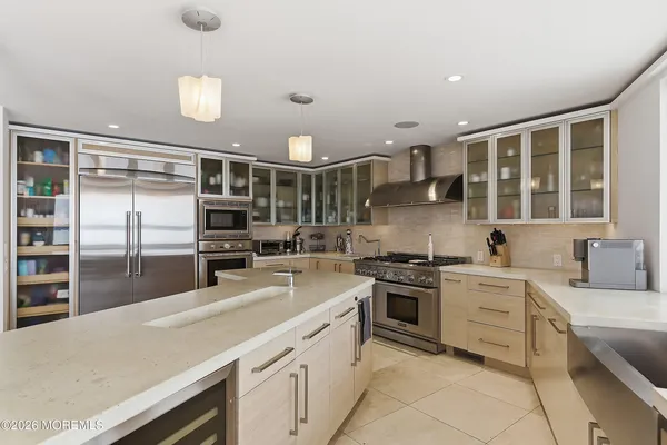a kitchen with cabinets and stainless steel appliances