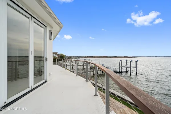 a view of a balcony with an ocean view