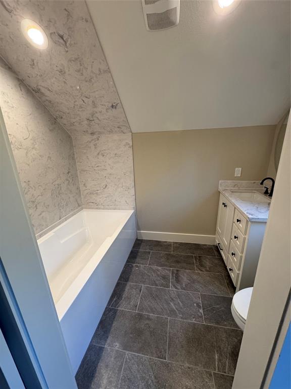 2340 Ft Graham Road Elm Mott, TX 76640 - Photo 19 of 24 a bathroom with a bathtub and toilet