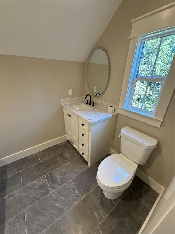 2340 Ft Graham Road Elm Mott, TX 76640 - Photo 21 of 24 a bathroom with a toilet sink and mirror