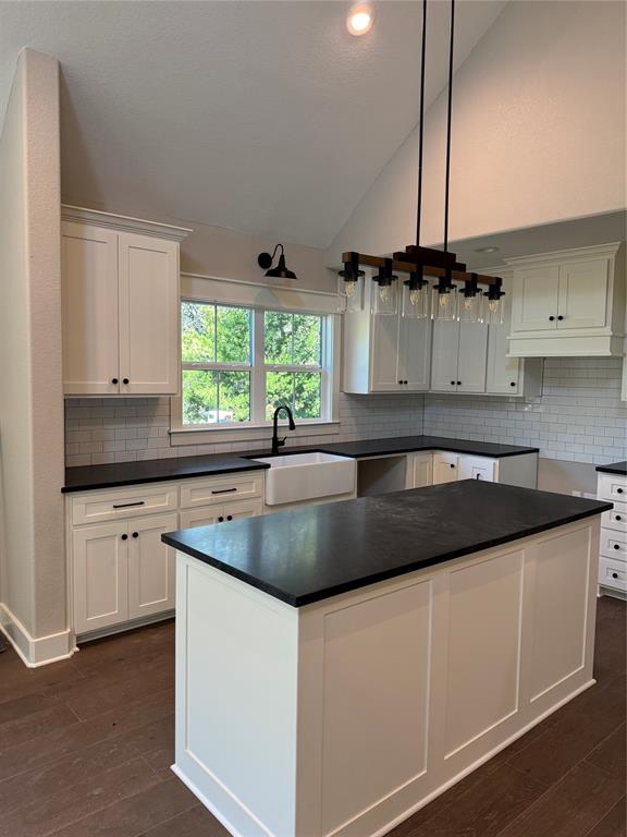 2340 Ft Graham Road Elm Mott, TX 76640 - Photo 4 of 24 a kitchen with kitchen island granite countertop a sink a counter top space and cabinets