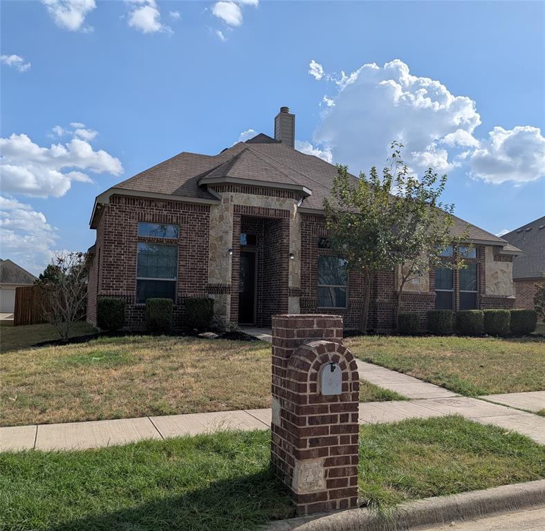 408 Valley Ridge Drive Red Oak, TX 75154 - Photo 2 of 3 Elegant brick exterior with arched entryway and stone accents