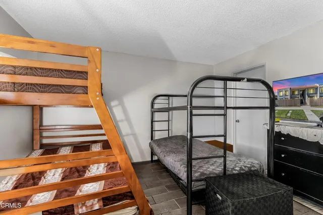 a view of staircase with a rug and a window