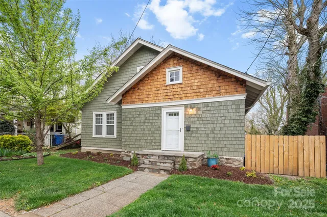 a view of backyard with a garden and deck